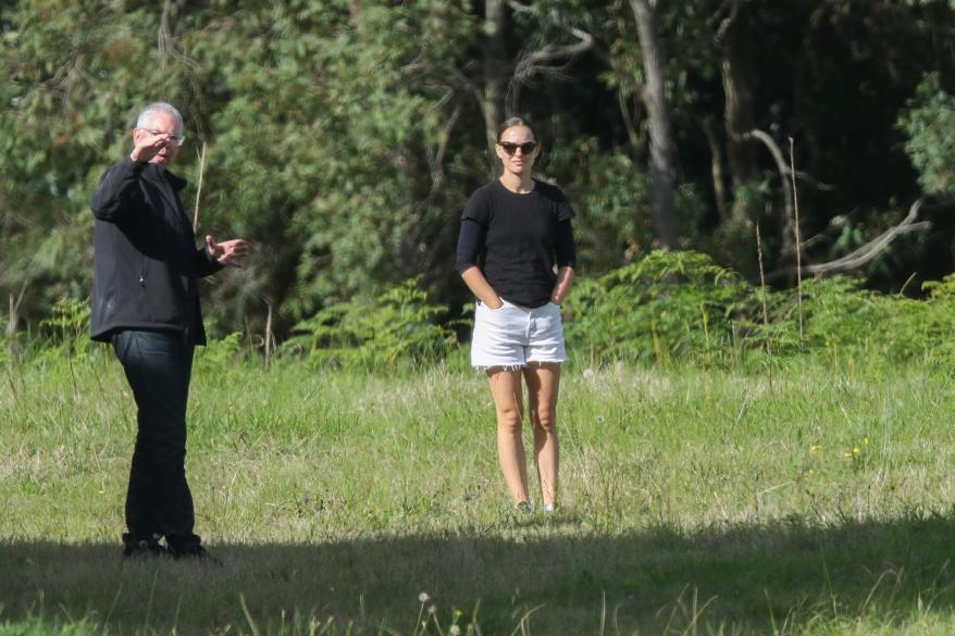 The 39-year-old “Black Swan” actress wore white cut-off shorts, a black top, black sneakers, sunglasses and a ponytail on her trip.