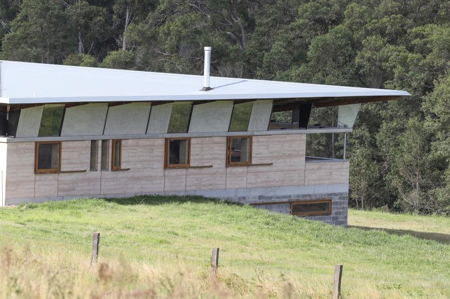 The exterior corner of the house is shown in this photo.