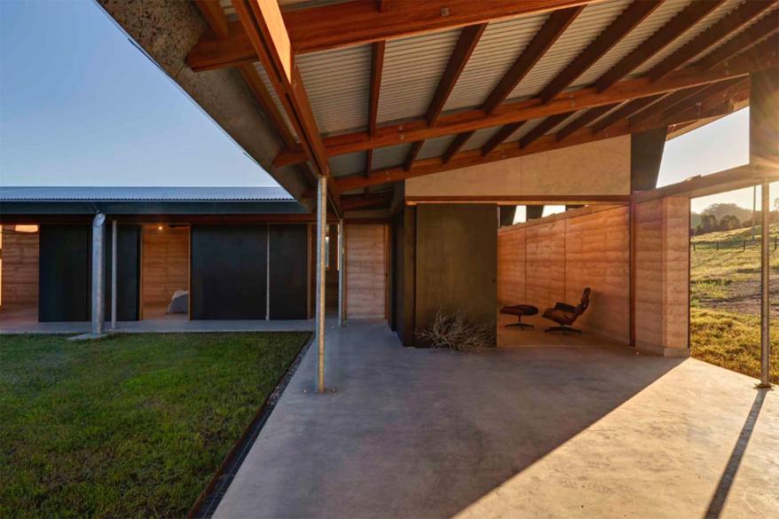 The house appears to have hardly any protection from the elements, but doors and windows are seamlessly integrated into the design.
