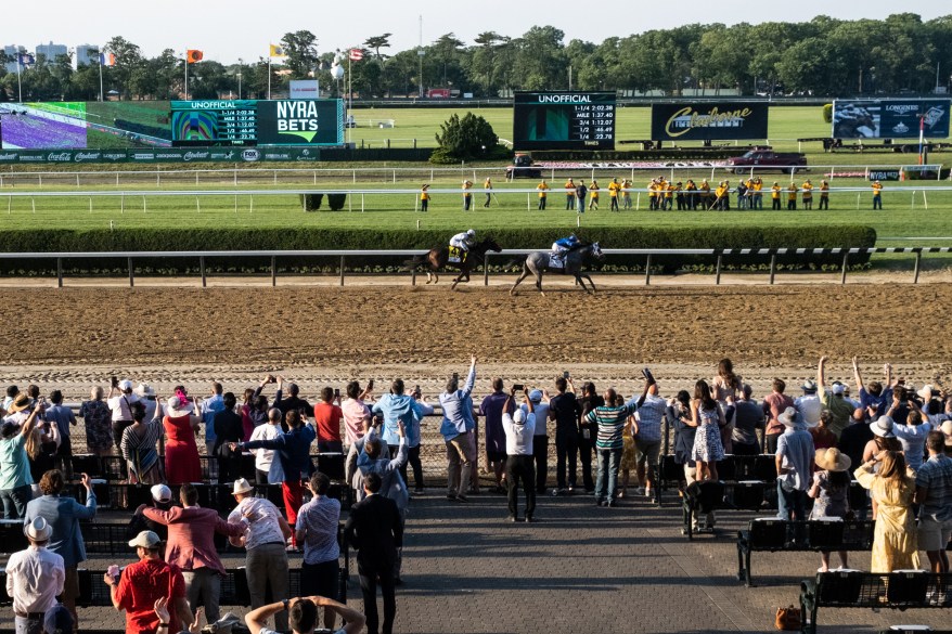 People attend the Belmont Stakes during a reduced capacity event as spectator sports reopen after the outbreak of Covid-19 on June 5, 2021.