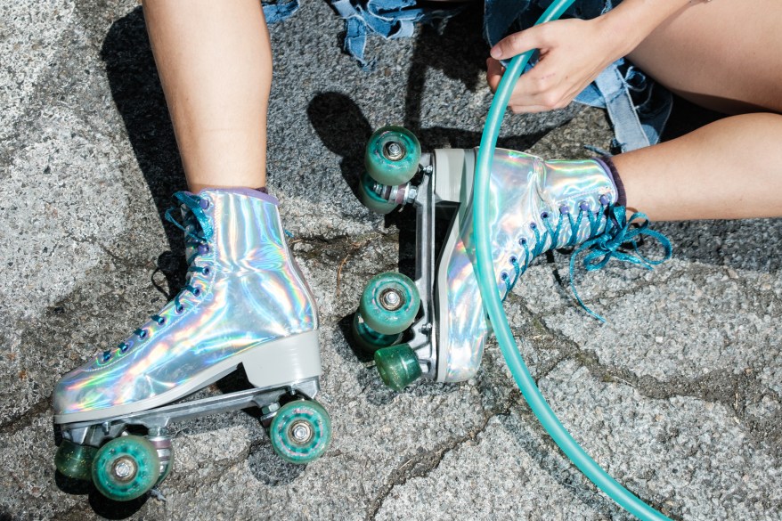 Artist and musician Mia Madden's rollerskates and hula hoop in Tompkins Square Park.