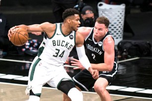 Giannis Antetokounmpo makes a move on Blake Griffin during the Nets' 115-107 Game 1 win over the Bucks.