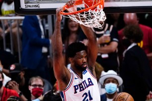 Joel Embiid, who scored 27 points, slams one home during the 76ers' 127-111 Game 3 win over the Hawks.