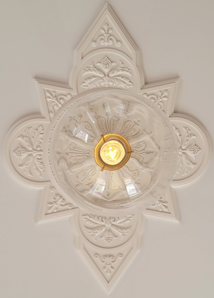 An restored rosette molding at the Captains House