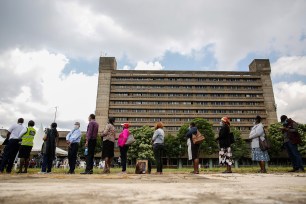 Kenyans line up to receive a dose of the AstraZeneca COVID-19 vaccine manufactured by the Serum Institute of India and provided through the global COVAX initiative, at Kenyatta National Hospital in Nairobi April 6, 2021.