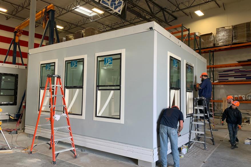 Contractors working on the Boxabl.