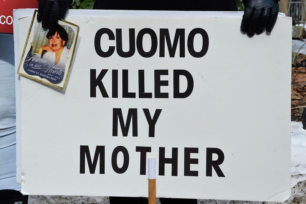A sign protesting against Gov. Cuomo and the nursing home order at a rally on February 24, 2021.