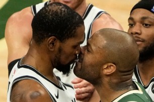 Kevin Durant and P.J. Tucker go nose to nose during the third quarter of the Bucks' win over the Nets.