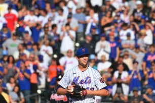 New York Mets fans stand on their feet and cheer for New York Mets starting pitcher Jacob deGrom