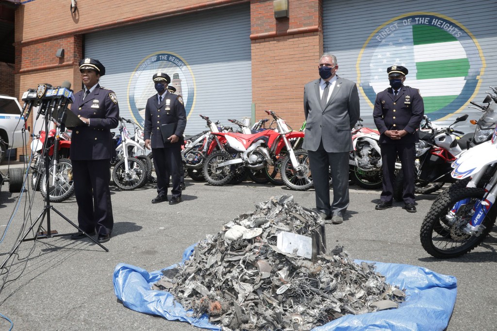 NYPD Transportation Bureau Chief Kim Royster (left), NYPD Chief of Department Rodney Harrison (center) and NYPD Deputy Commissioner Robert Martinez giving a Press conference on illegal motorcycles and ATV’s at the 33th Police Precinct.