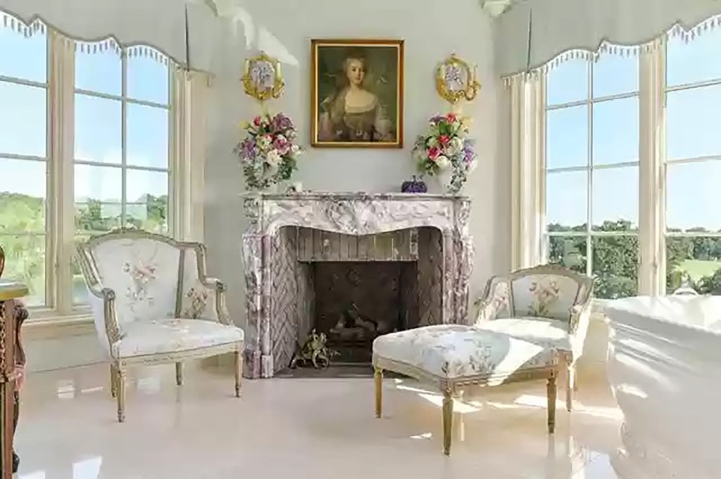 A classic painted portrait complements an imposing stone fireplace. 