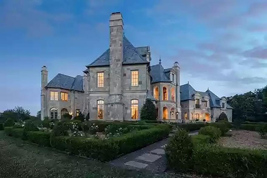 The five-bedroom, 6½-bathroom French-style mansion spans 12,300 square feet on seemingly endless expanses of lake and gardens, according to the listing.