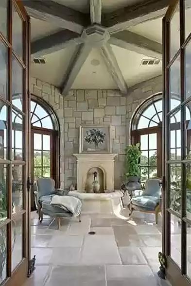 An octagonal sun room is pictured in this photo.