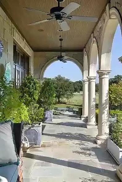 The grounds are visible from under the covered patio in this picture.