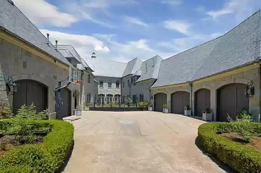 Guests approach through a long pathway and a motor court.