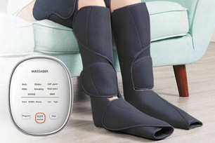 A pair of legs in compression massage slippers