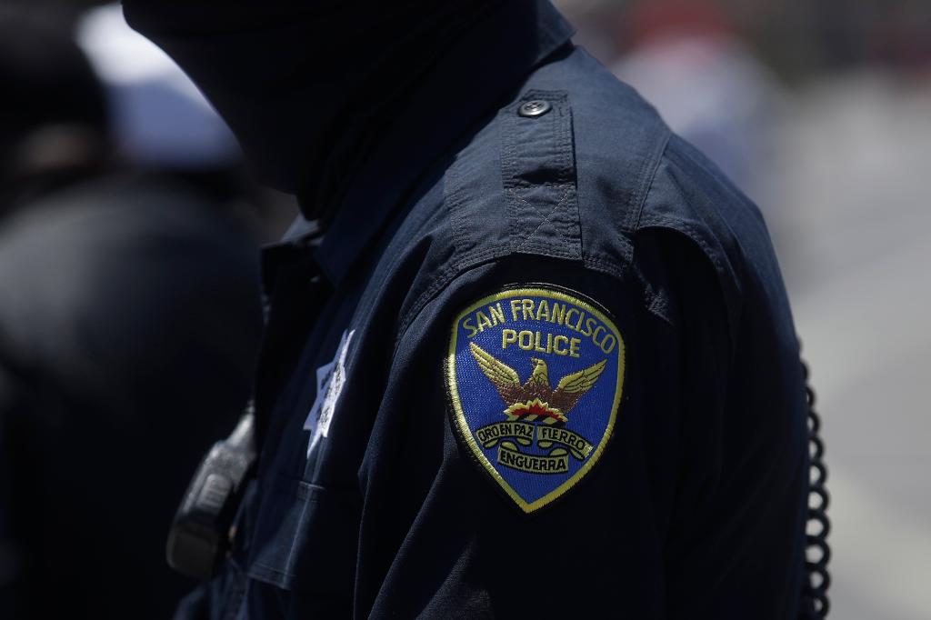 A San Francisco Police Department patch is shown on an officer's uniform in San Francisco. Law enforcement agencies across the country experienced a wave of retirements and departures and are struggling to recruit the next generation of police officers in the year since George Floyd was killed by a cop.