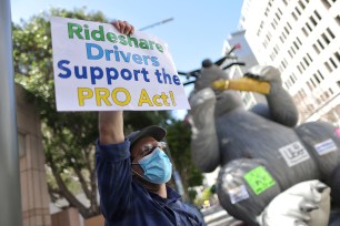 A man protesting in support of the Protecting the Right to Organize (PRO) Act in Los Angeles on March 16, 2021.