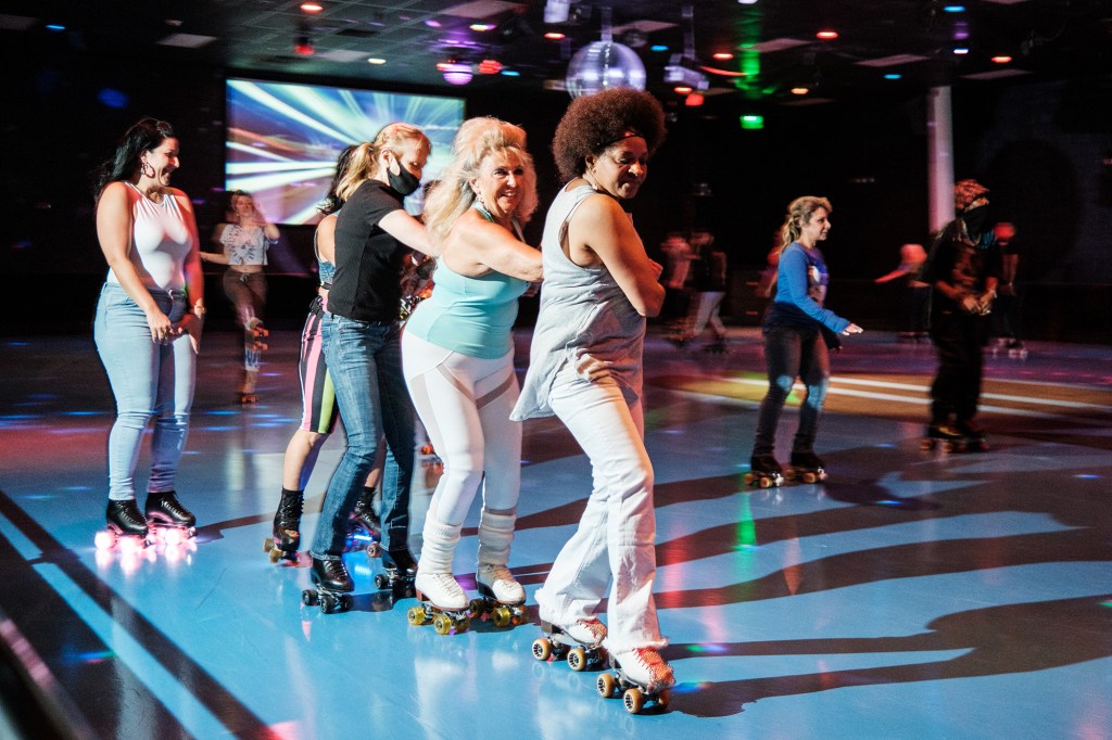 Rachel Montana (blue shirt) skating with friends  at Rollerjam USA.