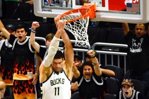 Brook Lopez, who scored a game-high 33 points, slams one home during the Bucks' 123-112 Game 5 win over the Hawks.