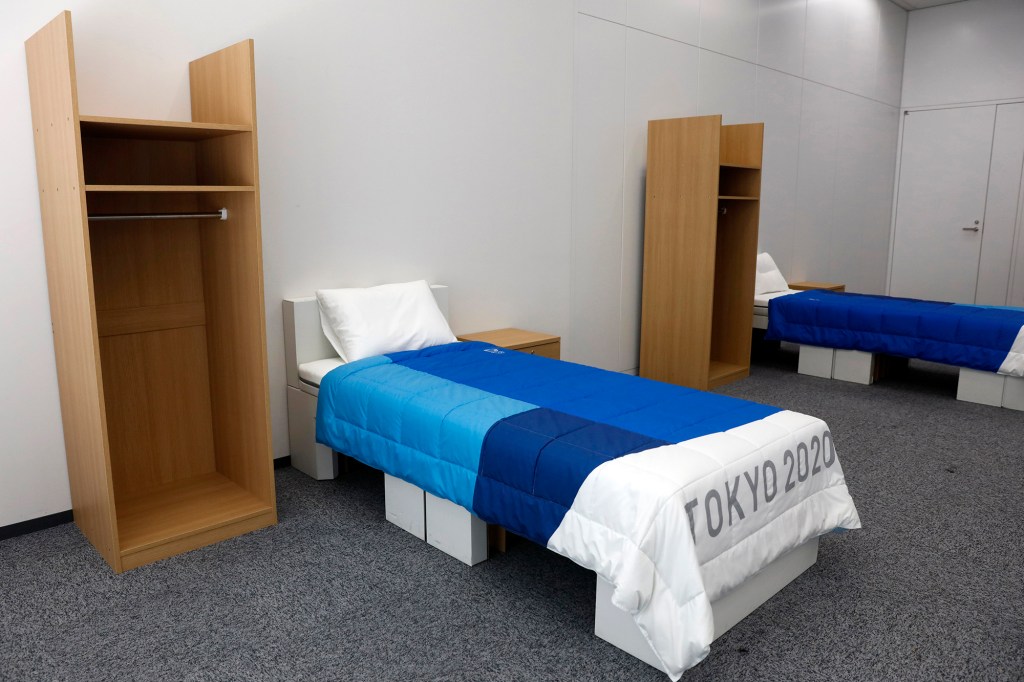 Two beds seen in a room in the Tokyo Olympic Village.