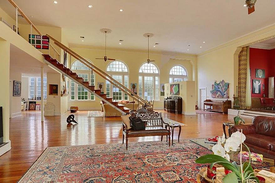 It has a 26-foot-tall great room, which was once the sanctuary, wood floors, a patio and a balcony, according to the listing.