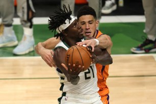 Devin Booker appears to foul Jrue Holiday in Game 4 of the NBA Finals.