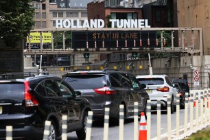Vehicles wait in traffic to enter Holland Tunnel on July 02, 2021 in Lower Manhattan in New York City.
