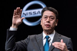 Nissan CEO Makoto Uchida gestures while speaking at a 2019 press conference