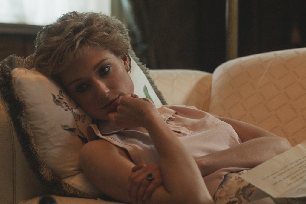 Elizabeth Debicki as Princess Diana in "The Crown" Season 5 lounges and looks glamorous.