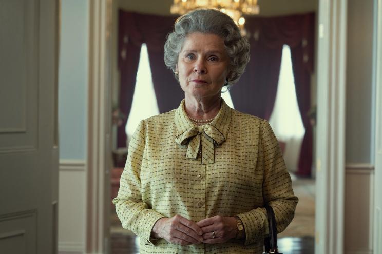 Imelda Staunton as Queen Elizabeth in "The Crown" Season 5 looking serious and standing in a room.