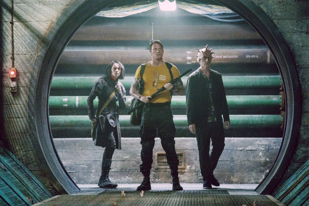 Joel Kinnaman (center) appearing in "The Suicide Squad."