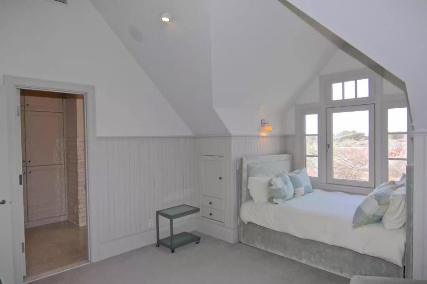 This bedroom has a windowsill reading nook.