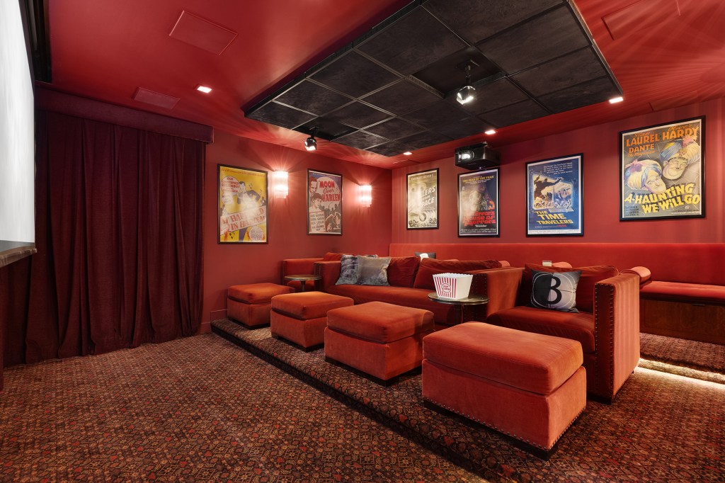 The home theater is decked out in velvet red with seating for nine, where his family usually watched movies like “The Kid Who Would Be King” on Sundays, he told The Post in 2019.