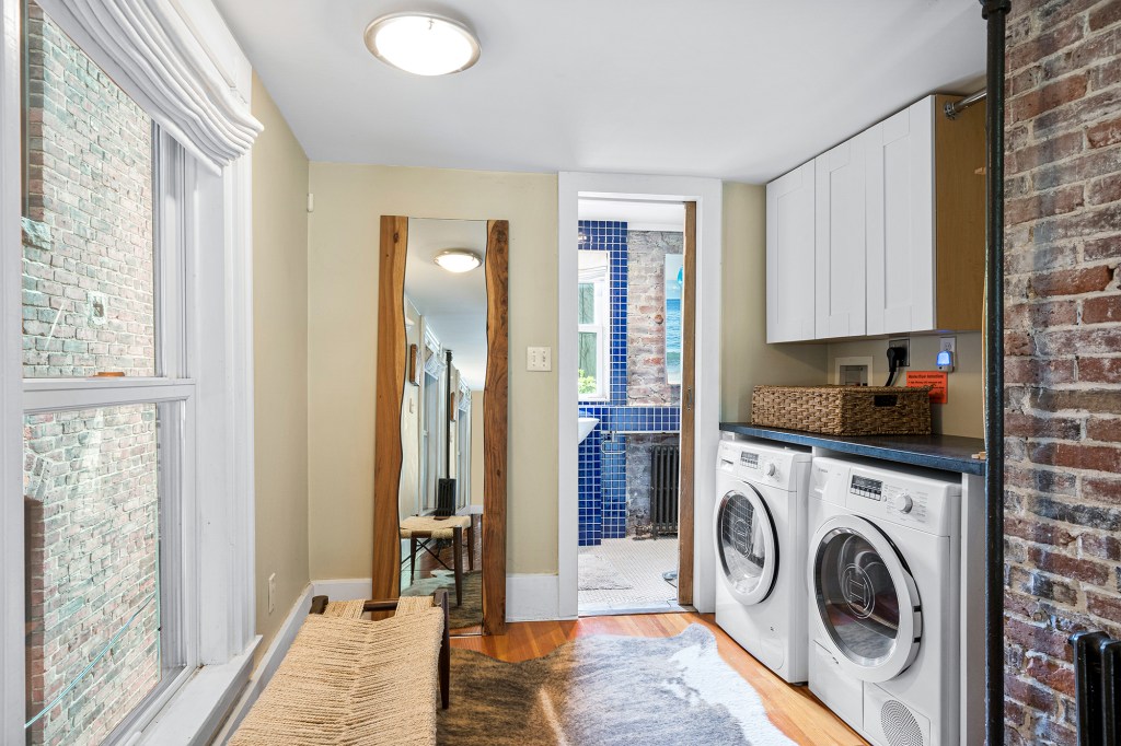 The new owner will get one bathroom, as well as a washer/dryer, in this petite pad.