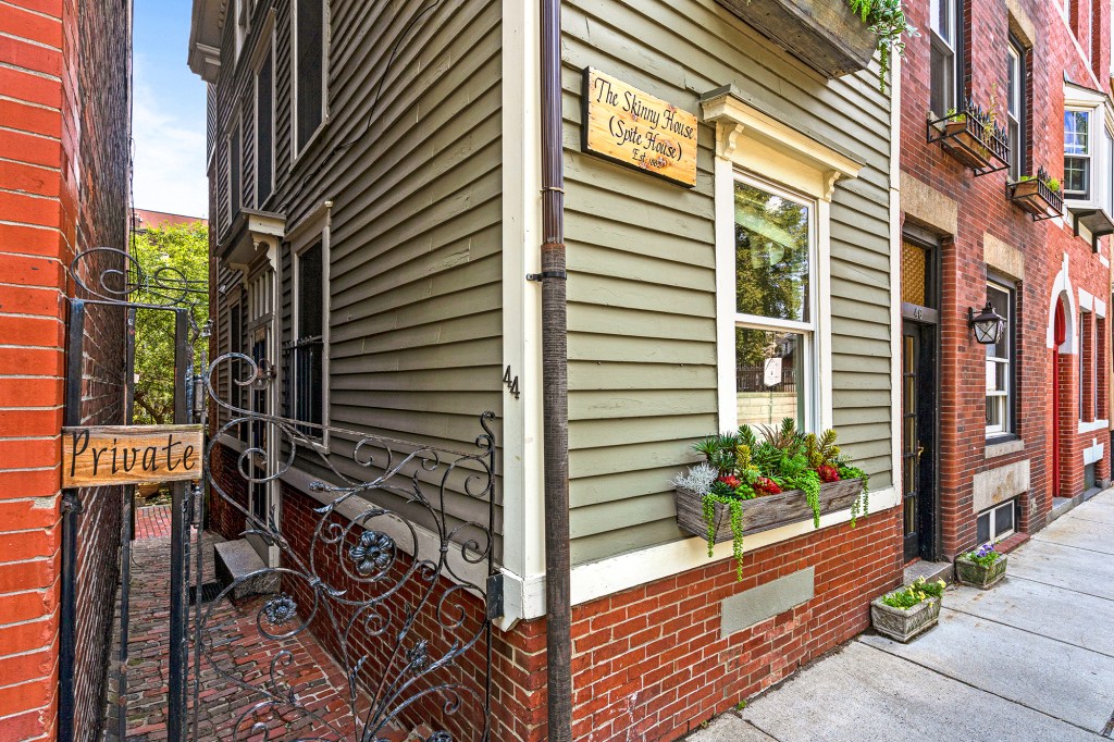 The entry is off to one side of the property and down an alleyway.