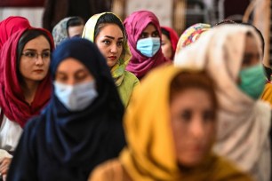 Afghan women take part in a gathering at a hall in Kabul o