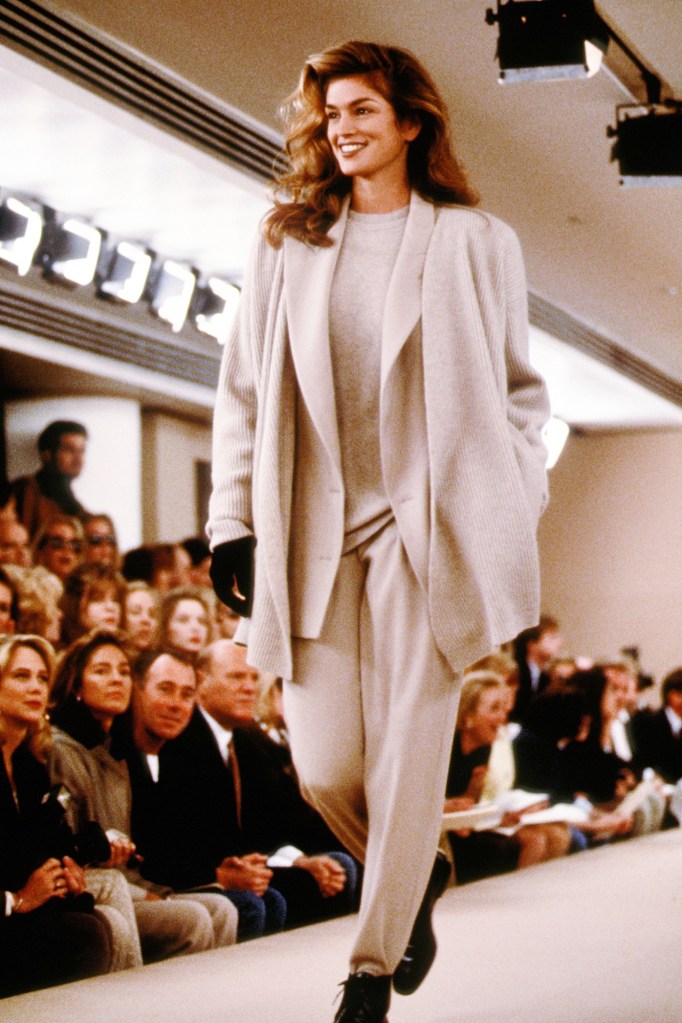 Cindy Crawford wears a tan Calvin Klein pantsuit at a 1992 New York Fashion Week show