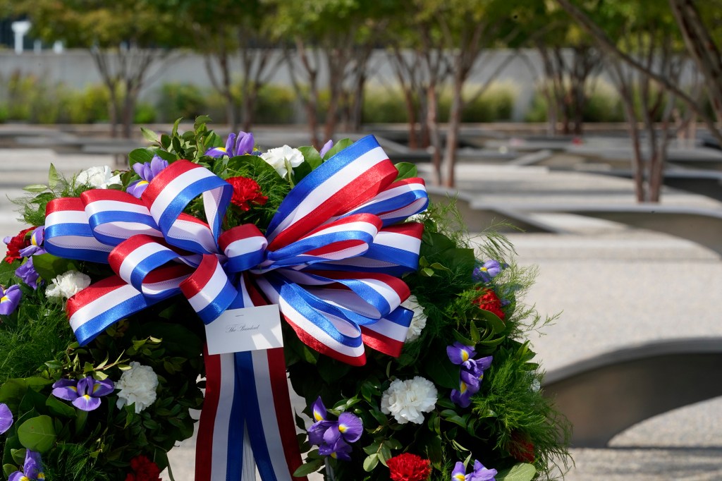 A wreath stands ready on the National 9/11 Pentagon Memorial site for a ceremony.
