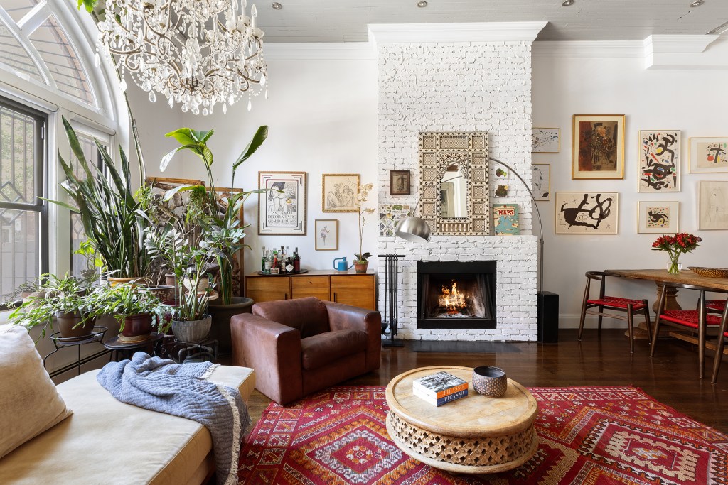 The living room comes with a wood-burning fireplace.