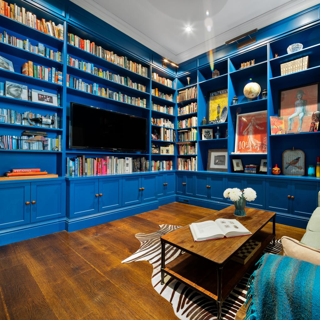 The newly renovated library with built-in bookshelves.