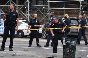 NYPD officers at the scene of where a teen was shot in East New York on September 28, 2021.