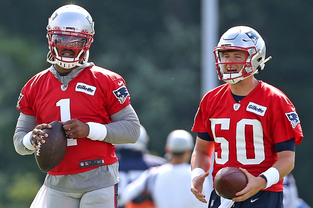 Cam Newton (left) and Mac Jones at Patriots practice on July 30, 2021.