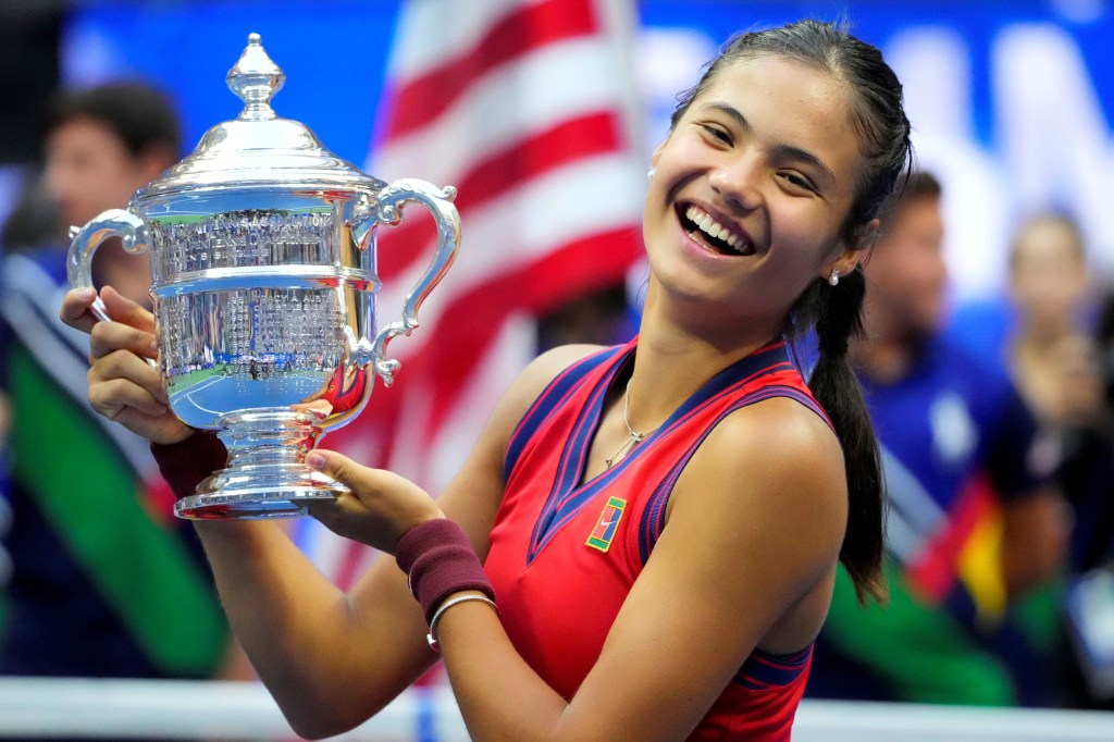 Emma Raducanu of Great Britain celebrates with the U.S. Open trophy on Sept. 11, 2021.