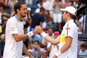 Daniil Medvedev (left) shakes hands with Botic van de Zandschulp of Netherlands after their US Open quarterfinal match.