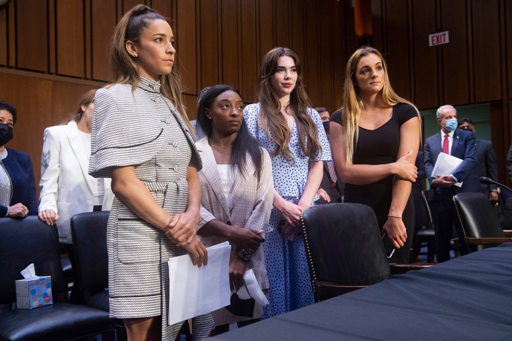 United States gymnasts from left, Aly Raisman, Simone Biles, McKayla Maroney and Maggie Nichols, leave after testifying at a Senate Judiciary hearing about the Inspector General's report on the FBI's handling of the Larry Nassar investigation.