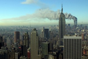 Smoke billows across the New York City skyline after two hijacked planes crashed into the twin towers on Sept. 11, 2001