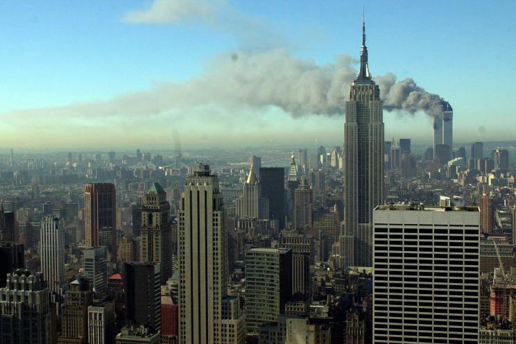 Smoke billows across the New York City skyline after two hijacked planes crashed into the twin towers on Sept. 11, 2001
