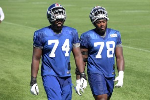 Matt Peart (left) and Andrew Thomas (right). Peart filled in for the injured Thomas in the Giants 25-3 win over the Panthers on Sunday.