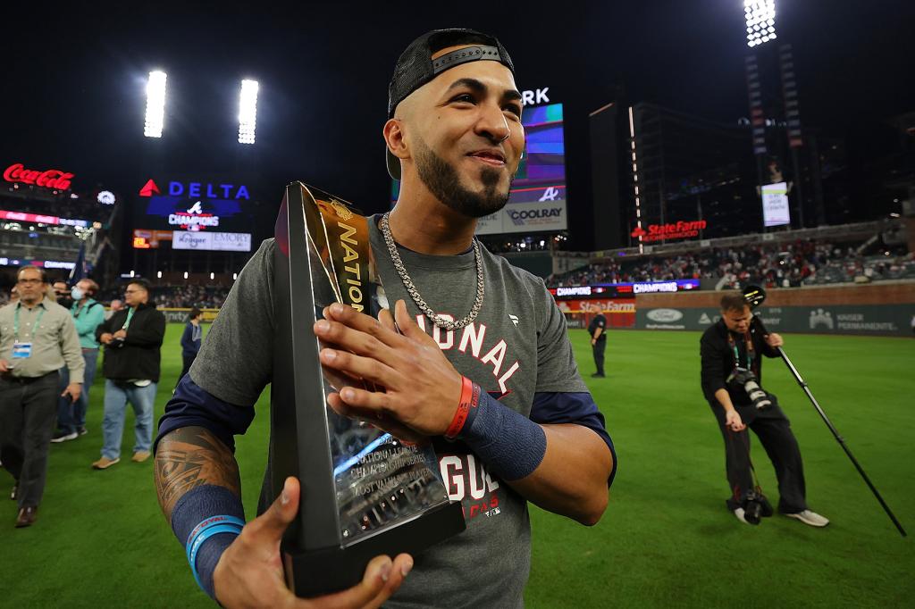 Eddie Rosario #8 of the Atlanta Braves celebrates after defeating the Los Angeles Dodgers in Game Six of the National League Championship Series at Truist Park on October 23, 2021 in Atlanta, Georgia. The Braves defeated the Dodgers 4-2 to advance to the 2021 World Series.